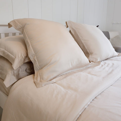 pink bedding on a king bed