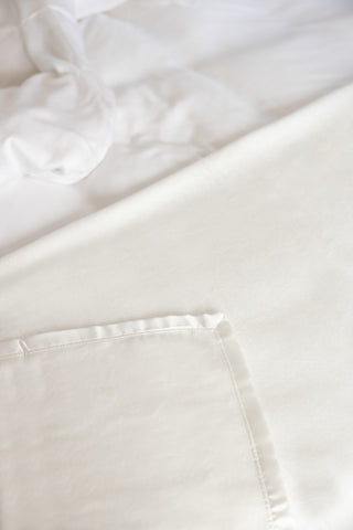 ethical bedding top sheet close up in white