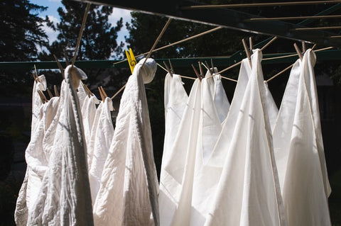 bed sheets on clothes line