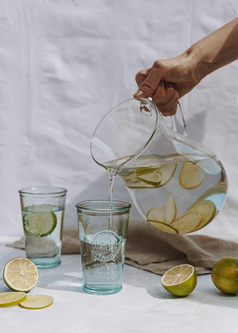 jug of water being poured into glass